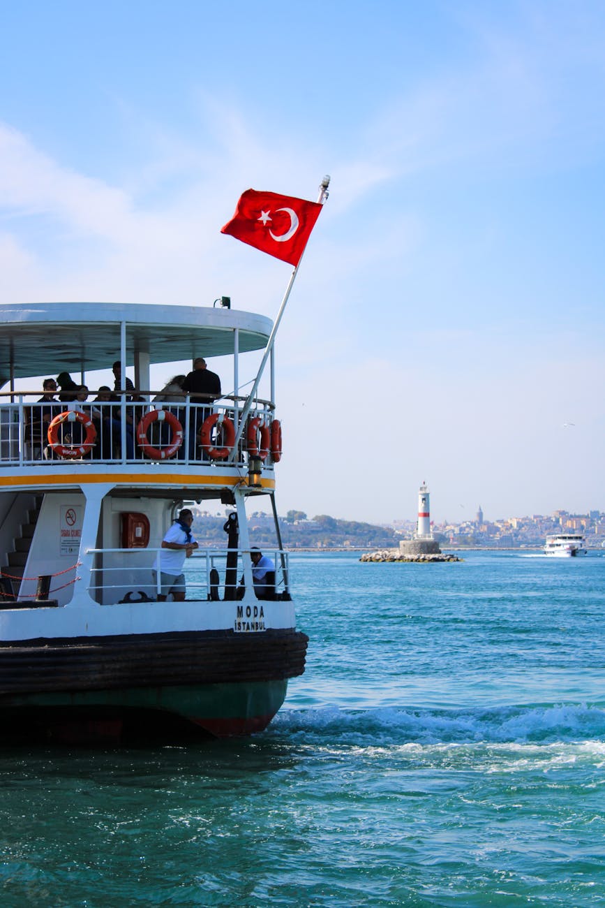 a ferry boat with a turkish flag on it