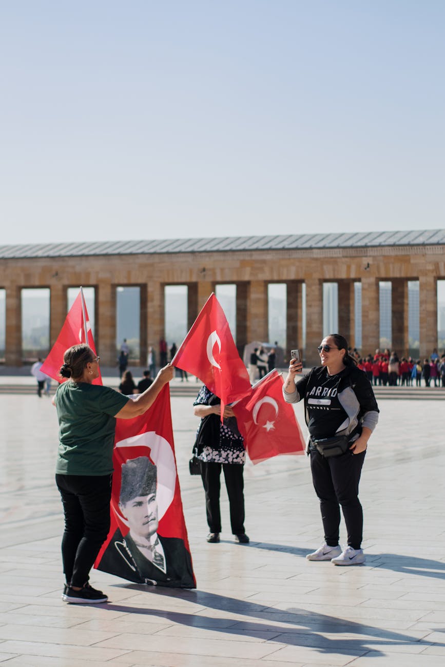 people with turkish flags at the anitkabir ankara turkey