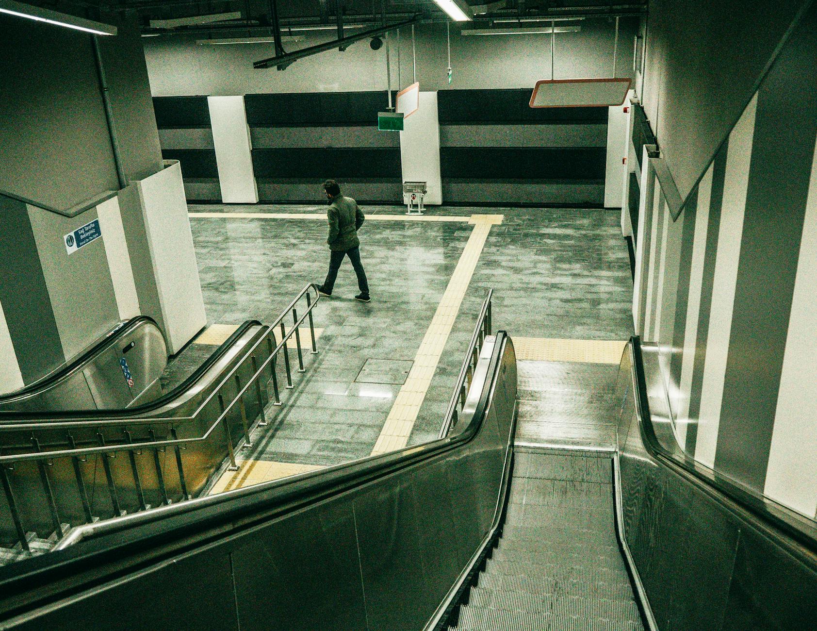 a man walking in the subway station