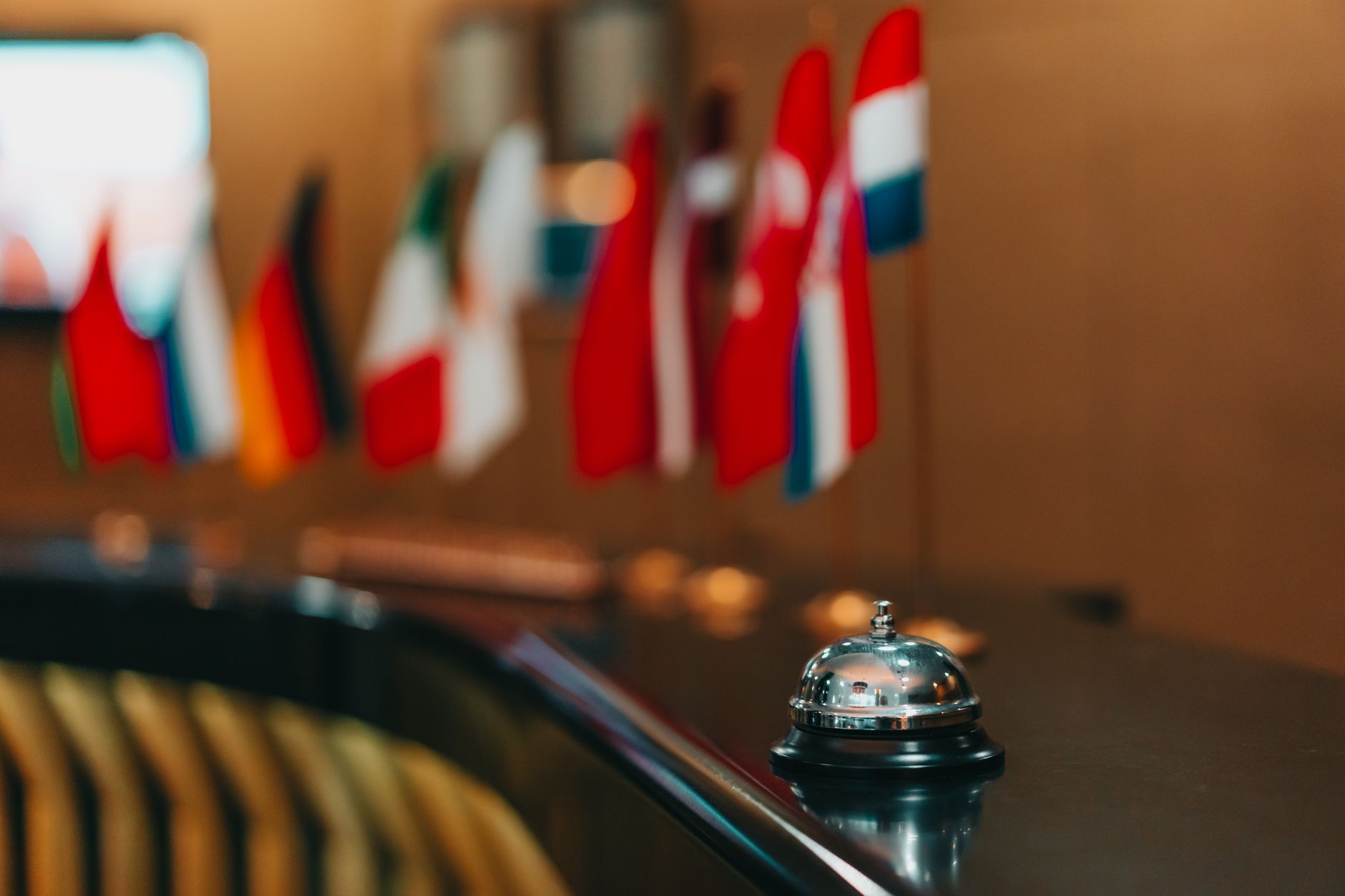 table bell with flags in background